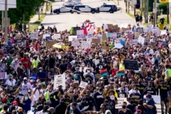 Hundreds march at a rally for Jacob Blake, Aug. 29, 2020, in Kenosha, Wis.
