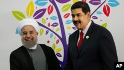  Hassan Rouhani et Nicolas Maduro,17è sommet du mouvement des pays Non-Alignés, 17 septembre 2016. (AP Photo/Ariana Cubillos)