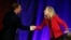 Virginia Congressman Dave Brat, R-Va., left, shakes hands with Democratic challenger Abigail Spanberger, right, after a debate at Germanna Community College in Culpeper, Virginia, Oct. 15, 2018. 