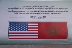 FILE - U.S. and Moroccan flags emblems are seen outside the provisional consulate of the U.S in Dakhla, Morocco-administered Western Sahara, Jan. 10, 2021.