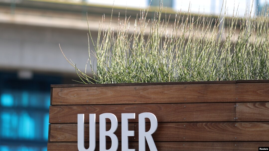 FILE - Signage for an Uber hub is seen in Redondo Beach, California, March 25, 2019.
