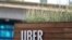 FILE - Signage for an Uber hub is seen in Redondo Beach, California, March 25, 2019.