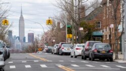 The Empire State building is seen in the distance from an empty street, Thursday, April 2, 2020, in the Brooklyn borough of New York. The new coronavirus causes mild or moderate symptoms for most people, but for some, especially older adults and…