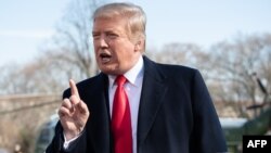 FILE - U.S. President Donald Trump speaks to the media prior to departing on Marine One from the South Lawn of the White House in Washington, March 28, 2019.