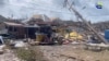 A person stands amidst damaged property following the passing of Hurricane Beryl, in Union Island, Saint Vincent and the Grenadines, in this screen grab taken from an Agency For Public Information handout video released on July 2, 2024.