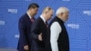 Chinese President Xi Jinping, Russian President Vladimir Putin and Indian Prime Minister Narendra Modi arrive for a photo during the BRICS summit in Kazan, Russia, on Oct. 23, 2024.