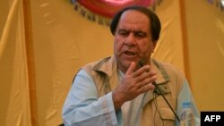 Fugitive former Afghan football chief, Keramuddin Karim, wanted for the sexual abuse of women footballers in Afghanistan, speaks during a defiant public appearance in the village of Malaspa near Bazarak in Panjshir province, north of Kabul, Sept. 4, 2020.