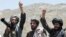 FILE - Taliban fighters react to a speech by their senior leader in the Shindand district of Herat province, Afghanistan. 