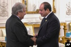 FILE - In this photo provided by Egypt's presidency media office, Egyptian President Abdel Fattah el-Sissi, right, greets UN Secretary-General Antonio Guterres, during the International peace summit at the New Administrative Capital, just outside Cairo, Egypt, Oct. 21, 2023.