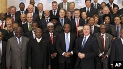 British Prime Minister David Cameron, bottom row third right, with delegates of London Conference on Somalia, Lancaster House, London, Feb. 23, 2012.