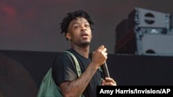 FILE - Rapper 21 Savage performs at the Lollapalooza music festival in Chicago, Illinois, Aug. 2, 2019. 