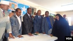 A family member of a passenger onboard the missing Malaysia Airlines Flight MH370 talks to reporters in a hotel in Beijing, March 14, 2014.