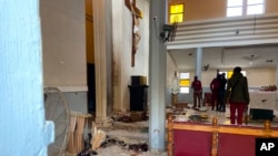 St Francis Catholic Church following an explosion in Owo Nigeria, Sunday, June 5, 2022. Lawmakers in southwestern Nigeria say more than 50 people are feared dead after gunmen opened fire and detonated explosives at a church. 