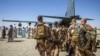 FILE - French soldiers stand in line as they board a military plane following their departure from Abeche military base as part of an on ongoing withdrawal of French Forces in Abeche on Jan. 11, 2025.