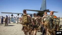 FILE - French soldiers stand in line as they board a military plane following their departure from Abeche military base as part of an on ongoing withdrawal of French Forces in Abeche on Jan. 11, 2025.