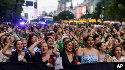 Women dressed as Eva Peron parade down the streets of Buenos Aires, Argentina, May. 6, 2019.