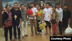 The three activists and their families stand in front of a prison in Koh Kong province on July 1, 2016. (Photo provided by Licadho) 