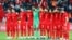 Turkey's players observe a minute of silence for the victims of the Paris attacks before their soccer match Nov. 17, 2015, against Greece in Istanbul.