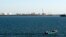 FILE - A speed boat passes by oil docks at the port of Kalantari in the city of Chabahar, 300km (186 miles) east of the Strait of Hormuz, Jan. 17, 2012. 