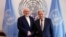 Iranian Foreign Minister Mohammad Javad Zarif, left, shakes hands with U.N. Secretary General Antonio Guterres at United Nations headquarters, July 18, 2019. 