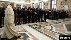 FILE - Pope Francis meets with the representatives of Italy's National Amateur League (Lega Nazionale Dilettanti) at the Vatican.