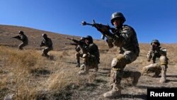 Afghan National Army (ANA) soldiers take part in a training exercise at a military base in Kabul Nov. 23, 2014.