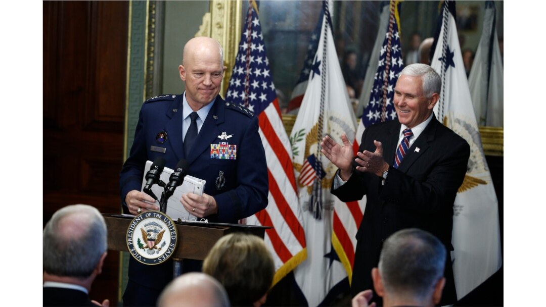 Vice President Mike Pence, right, applauds during swearing in ceremony for Air Force General John Raymond as Chief of Space Operations, in his Ceremonial Office in the White House complex, Jan. 14, 2020 in Washington.