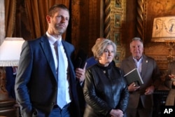 From left, U.S. President-elect Donald Trump's son Eric Trump, his chief of staff Susie Wiles and his Middle East envoy Steve Witkoff listen as he speaks during a news conference at Mar-a-Lago on Jan. 7, 2025, in Palm Beach, Florida.