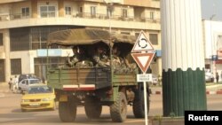 A military vehicle carrying French soldiers patrols a street near the presidential palace in Bangui, December 31, 2012.