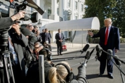 President Donald Trump speaks to the media as he leaves the White House before departing to India, Feb. 23, 2020,