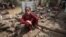 A Pakistani girl in what is left of her house in Nowshera, near Peshawar, Pakistan, Aug. 22, 2012. 