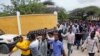 Mourners carry the body of the Chairwoman of the Shangani district, who was killed during an attack on Wednesday, in Mogadishu, Somalia, Thursday, July 25, 2019. 