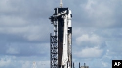 A SpaceX Falcon 9 rocket sits on Kennedy Space Center's Launch Pad 39-A, Sept. 15, 2021, in Cape Canaveral , Fla. The rocket was poised to carry four civilians into space. 