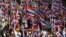 Protesters against the government-backed amnesty bill hold Thai national flags as they march in central Bangkok November 14, 2013.