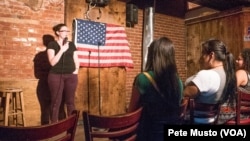 Comedian Katherine Jessup tells jokes at the Town Tavern open mike in Washinston, DC. (Peter Musto/VOA)