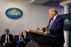 President Donald Trump speaks at a news conference at the White House, in Washington, Aug. 12, 2020.