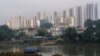 This photo taken on Jan. 11, 2019 shows the river separating the town of Muse in Myanmar (foreground) and Ruili in China (background), as seen from Muse in Shan State.