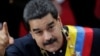 FILE - Venezuela's President Nicolas Maduro gestures as he arrives for a session of the National Constituent Assembly at Palacio Federal Legislativo in Caracas, Venezuela, Aug. 10, 2017.