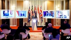 [FILE] In this photo provided by Malaysia Defense Ministry, Malaysian Defense Minister Hishammuddin Hussein speaks during a press conference after the Five Powers Defense Arrangements (FPDA) meeting in Kuala Lumpur, Malaysia, Thursday, Oct. 21, 2021.