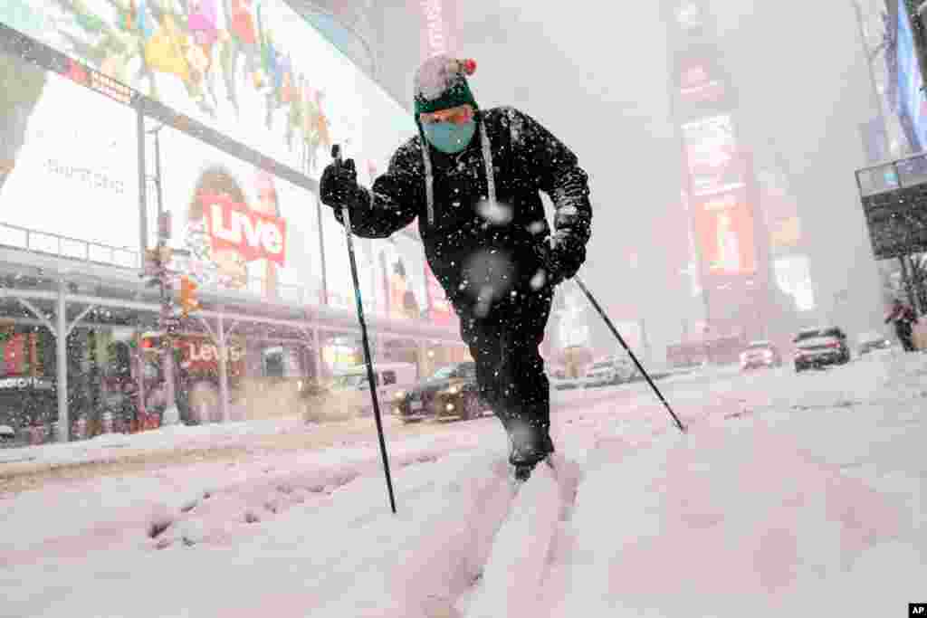 Steve Kent skis through Times Square during a snowstorm in the Manhattan borough of New York.