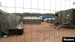 A general view of the newly installed tents in Lithuania's migrant processing centre in Pabrade, Lithuania June 15, 2021. REUTERS/Ints Kalnins