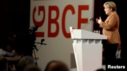 German Chancellor Angela Merkel (CDU) delivers a speech at a congress of the Industrial Mining, Chemistry, Energy Union (IG BCE) in Hanover, Oct. 16, 2013. 