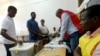 A man casts his vote during the presidential, legislative and provincial elections in Maputo, Mozambique, Oct., 15, 2019. 