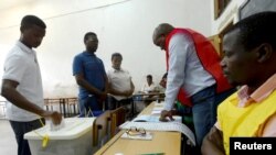 A man casts his vote during the presidential, legislative and provincial elections in Maputo, Mozambique, Oct., 15, 2019. 