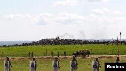 FILE - Turkish soldiers secure the border line between Turkey and Syria near the town of Suruc, Sanliurfa province, March 17, 2015.