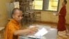 A Cambodian Buddhist monk casts his ballot, file photo. 