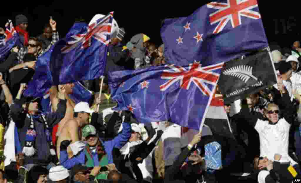 Supporters celebrate after New Zealand's Winston Reid scored the equalizing goal during the World Cup group F soccer match between New Zealand and Slovakia at Royal Bafokeng Stadium in Rustenburg, South Africa, on Tuesday, June 15, 2010. (AP Photo/Lee Ji