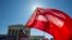 Equality flag waves during demonstrations in front of the Supreme Court, Washington, April 28, 2015. 