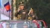 FILE - Cambodian Prime Minister Hun Sen (L) salutes, along with his son, Lt. Gen. Hun Manet (background), during an inspection of troops at a ceremony in Phnom Penh, Cambodia, Jan. 24, 2019. (Handout via AFP)