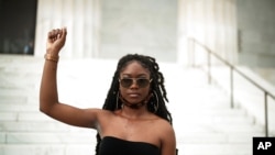 FILE - Aalayah Eastmond, a Parkland, Fla. activist, poses for a portrait after leading the crowd in chants at the Lincoln Memorial in Washington, June 10, 2020.